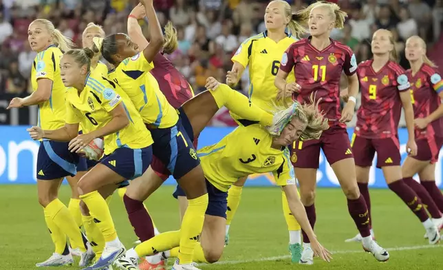 Sweden's Madelen Janogy cites her teammate Linda Sembrant with the boot on the face during the Women's Euro 2025, group C, soccer match between Sweden and Germany at Stadion Letzigrund in Zurich, Switzerland, Saturday, July 12, 2025. (AP Photo/Martin Meissner)