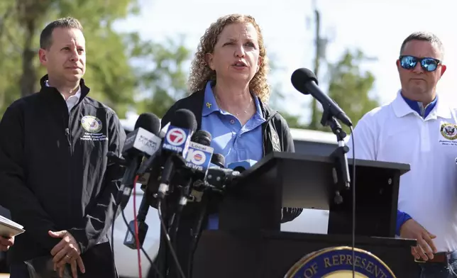 Rep. Debbie Wasserman Schultz speaks outside the migrant detention facility dubbed "Alligator Alcatraz" during a news conference ahead of a tour of the Dade-Collier Training and Transition Facility, Saturday, July 12, 2025, in Ochopee, Fla. (AP Photo/Alexandra Rodriguez)