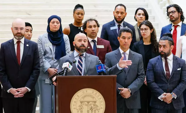 Attorney Giovanni Diaz, representing Spanish-language journalist Mario Guevara speaks at a press conference at the Georgia State Capitol in Atlanta, on Tuesday, July 22, 2025. (Miguel Martinez/Atlanta Journal-Constitution via AP)