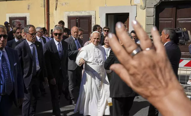 Pope Leo XIV arrives at the papal summer residence in Castel Gandolfo south of Rome for a six-week vacation, Sunday. (AP Photo/Andrew Medichini)