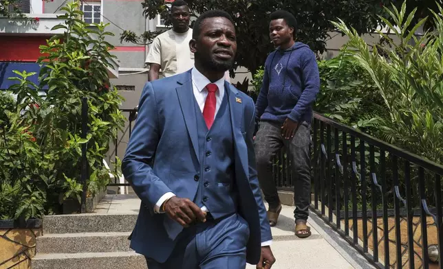 Ugandan singer, politician, and opposition figure Bobi Wine walks out of his political party office (National Unity Platform) in Kampala, Uganda, Thursday, July 24, 2025. (AP Photo/Hajarah Nalwadda)