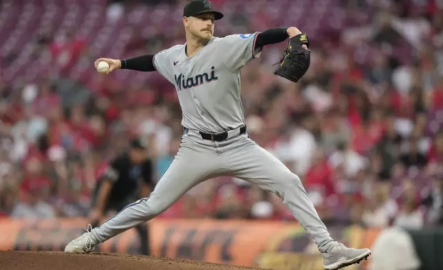 Miami Marlins pitcher Janson Junk throws in the second inning of a baseball game against the Cincinnati Reds in Cincinnati, Monday, July 7, 2025. (AP Photo/Carolyn Kaster)