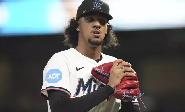Miami Marlins starting pitcher Eury Perez walks to the dugout after pitching during the first inning of a baseball game against the Minnesota Twins, Thursday, July 3, 2025, in Miami. (AP Photo/Lynne Sladky)