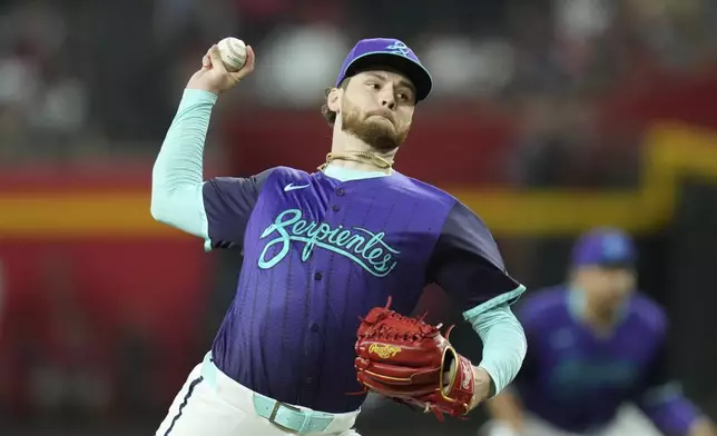 Arizona Diamondbacks starting pitcher Ryne Nelson throws against the Kansas City Royals during the first inning of a baseball game Saturday, July 5, 2025, in Phoenix. (AP Photo/Ross D. Franklin)