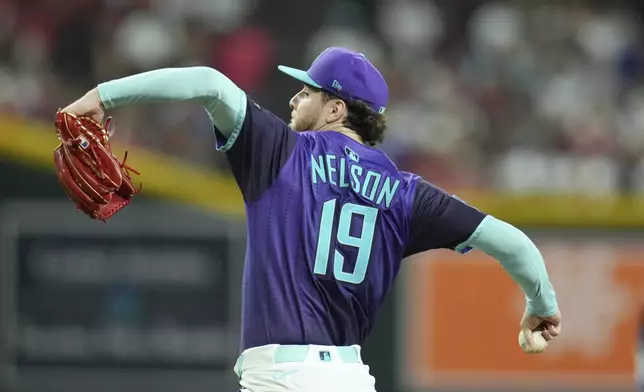 Arizona Diamondbacks starting pitcher Ryne Nelson throws against the Kansas City Royals during the fourth inning of a baseball game Saturday, July 5, 2025, in Phoenix. (AP Photo/Ross D. Franklin)