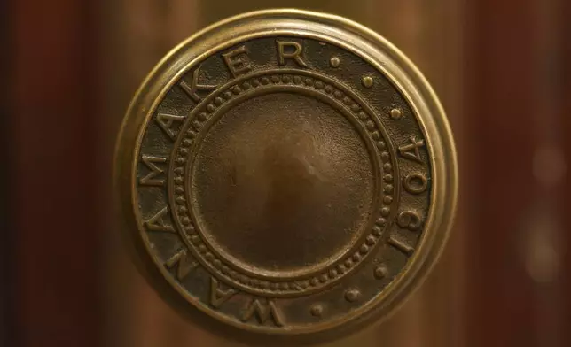 A door knob to the interior of the Wanamaker organ is seen during a performance at the storied Wanamaker Building, July 24, 2025, in Philadelphia. (AP Photo/Matt Slocum)