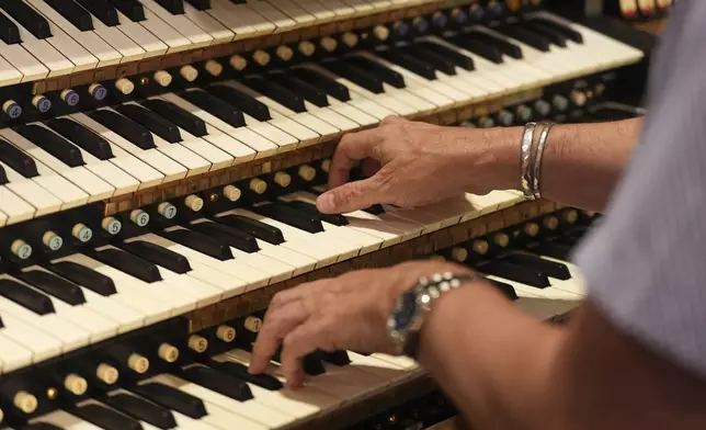 Peter Richard Conte, Wanamaker grand court organist, performs at the storied Wanamaker Building, July 24, 2025, in Philadelphia. (AP Photo/Matt Slocum)