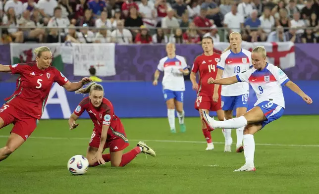 England's Beth Mead, right, shoots to score her sides fifth goal during the Women's Euro 2025, group D, soccer match between England and Wales at Arena St. Gallen in St. Gallen, Switzerland, Sunday, July 13, 2025. (AP Photo/Martin Meissner)