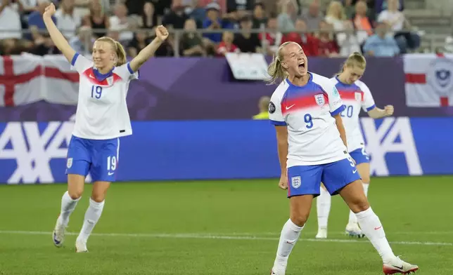 England's Beth Mead, right, celebrates after scoring her sides fifth goal during the Women's Euro 2025, group D, soccer match between England and Wales at Arena St. Gallen in St. Gallen, Switzerland, Sunday, July 13, 2025. (AP Photo/Martin Meissner)