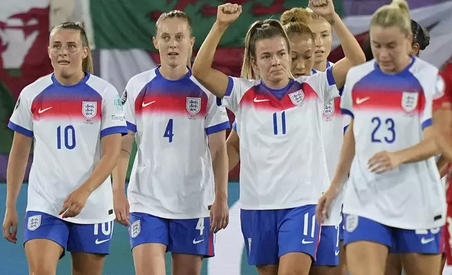 England's Lauren Hemp, center, celebrates with teammates after scoring her sides third goal during the Women's Euro 2025, group D, soccer match between England and Wales at Arena St. Gallen in St. Gallen, Switzerland, Sunday, July 13, 2025. (AP Photo/Martin Meissner)
