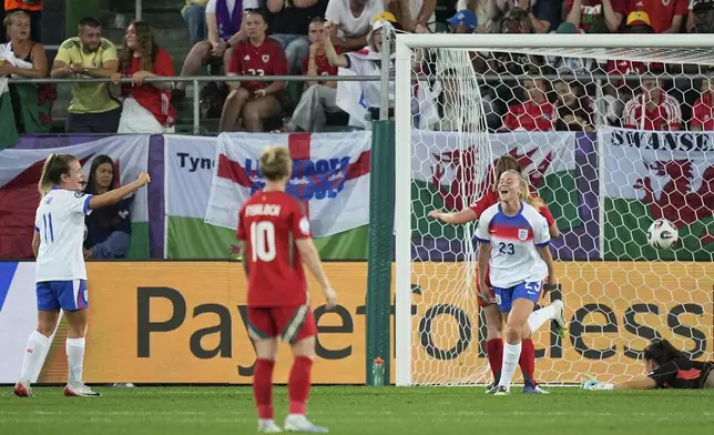 England's Alessia Russo, right, celebrates after scoring her sides fourth goal during the Women's Euro 2025, group D, soccer match between England and Wales at Arena St. Gallen in St. Gallen, Switzerland, Sunday, July 13, 2025. (AP Photo/Martin Meissner)
