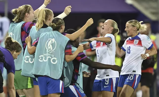 England's Beth Mead, center, celebrates with teammates after scoring during the UEFA Women's EURO 2025 Group D soccer match against Wales at the Arena St. Gallen in St. Gallen, Switzerland, Sunday, July 13, 2025. (Gian Ehrenzeller/Keystone via AP)