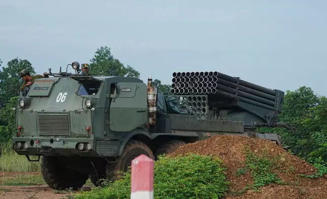A Cambodian military vehicle carries rocket launcher in Oddar Meanchey province, Cambodia, Friday, July 25, 2025, as Thai and Cambodian soldiers have clashed along the border between their countries in a major escalation. (AP Photo/Heng Sinith)