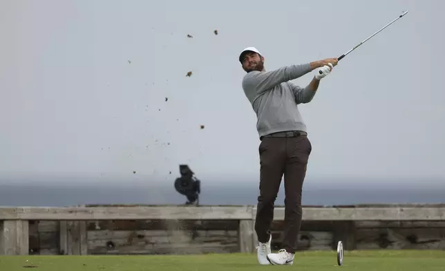 Scottie Scheffler of the United States plays his tee shot on the 6th tee during the first round of the British Open golf championship at the Royal Portrush Golf Club, Northern Ireland, Thursday, July 17, 2025. (AP Photo/Peter Morrison)