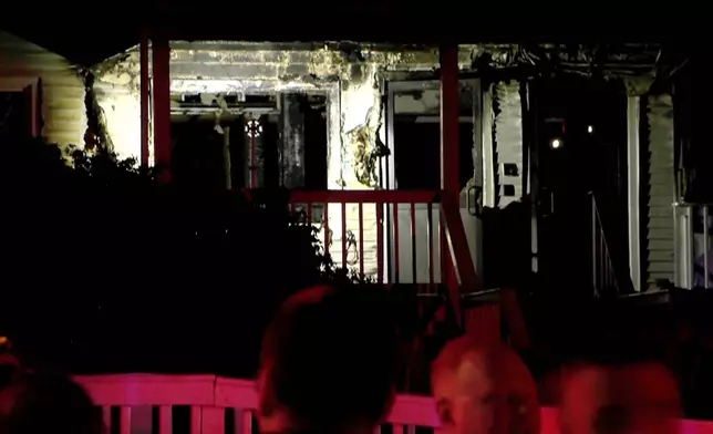 This image taken from video provided by WLNE-TV shows authorities working on the scene of a fire at an assisted living facility in Fall River, Mass., Sunday, July 13, 2025. (WLNE-TV via AP)
