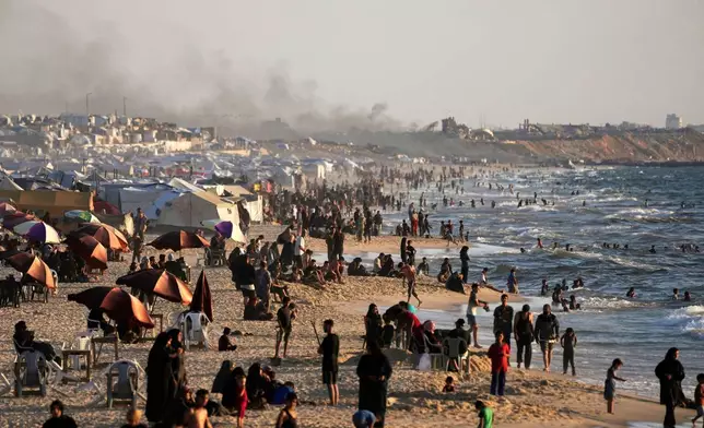 Palestinians spend time at the seafront during a heat wave in Gaza City, Wednesday, July 2, 2025. (AP Photo/Jehad Alshrafi)