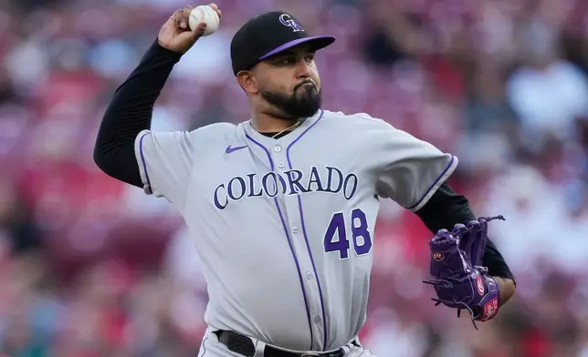 Colorado Rockies pitcher Germán Márquez throws during the first inning of a baseball game against the Cincinnati Reds in Cincinnati, Friday, July 11, 2025. (AP Photo/Carolyn Kaster)