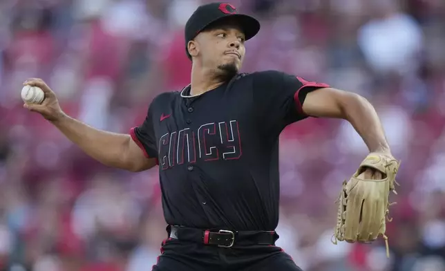 Cincinnati Reds pitcher Chase Burns throws during the first inning of a baseball game against the Colorado Rockies in Cincinnati, Friday, July 11, 2025. (AP Photo/Carolyn Kaster)