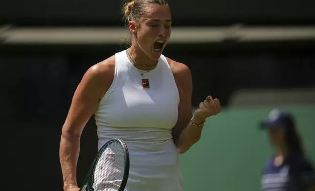 Aryna Sabalenka of Belarus reacts during her match against Carson Branstine of Canada at their first round women's single match at the Wimbledon Tennis Championships in London, Monday, June 30, 2025. (AP Photo/Kin Cheung)