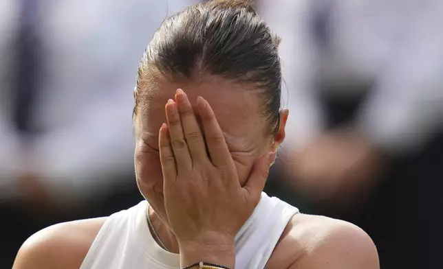 Amanda Anisimova of the U.S. reacts after losing the women's singles final match against Iga Swiatek of Poland at the Wimbledon Tennis Championships in London, Saturday, July 12, 2025.(AP Photo/Kirsty Wigglesworth)