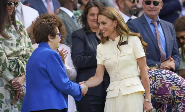 Britain's Kate, Princess of Wales shakes hands with tennis legend Billie Jean King in the Royal Box on Centre Court ahead of the women's singles final at the Wimbledon Tennis Championships in London, Saturday, July 12, 2025. (AP Photo/Kin Cheung)