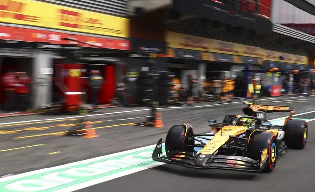 McLaren driver Lando Norris of Britain steers his car during qualification ahead of the Formula One Grand Prix at the Spa-Francorchamps racetrack in Spa, Belgium, Saturday, July 26, 2025. (Manon Cruz, Pool Photo via AP)