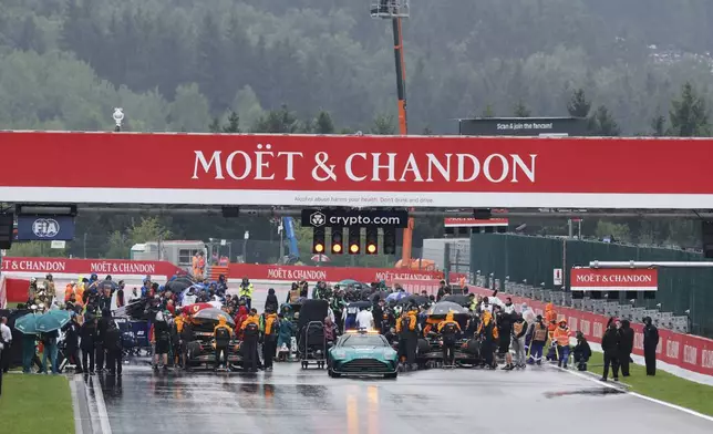 Cars begin to line up on the grid prior to the start of the Formula One Grand Prix at the Spa-Francorchamps racetrack in Spa, Belgium, Sunday, July 27, 2025. (AP Photo/Geert Vanden Wijngaert)