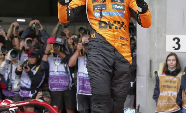 McLaren driver Oscar Piastri of Australia celebrates after winning the Formula One Grand Prix at the Spa-Francorchamps racetrack in Spa, Belgium, Sunday, July 27, 2025. (Yves Herman, Pool Photo via AP)