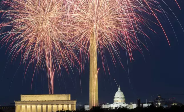 FILE - Fireworks burst above the National Mall and, from left, the Lincoln Memorial, Washington Monument and the U.S. Capitol building, during Independence Day celebrations in Washington on July 4, 2023. (AP Photo/Stephanie Scarbrough, File)