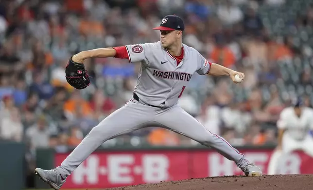 Washington Nationals starting pitcher MacKenzie Gore throws against the Houston Astros during the first inning of a baseball game Wednesday, July 30, 2025, in Houston. (AP Photo/David J. Phillip)