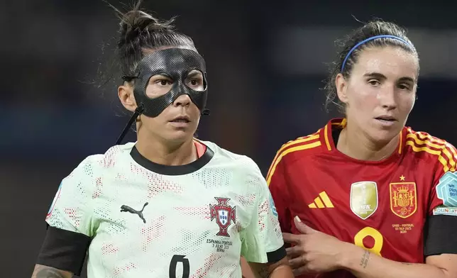 Portugal's Ana Borges and Spain's Mariona Caldentey, right, during the Euro 2025, group B, soccer match between Spain and Portugal at Stadion Wankdorf in Bern, Switzerland, Thursday, July 3, 2025. (AP Photo/Martin Meissner)