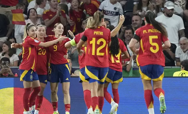 Spain's Esther Gonzalez, 3rd left, celebrates after scoring her side's fourth goal during the Euro 2025, group B, soccer match between Spain and Portugal at Stadion Wankdorf in Bern, Switzerland, Thursday, July 3, 2025. (AP Photo/Martin Meissner)
