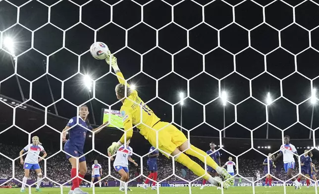 France goalkeeper Pauline Peyraud-Magnin touches the ball but fails to stop a goal by England's Keira Walsh during the Euro 2025, group D, soccer match between France and England at Stadion Letzigrund in Zurich, Switzerland, Saturday, July 5, 2025. (AP Photo/Martin Meissner)