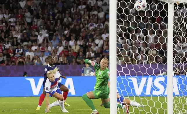 France's Sandy Baltimore, background, scores her side's second goal during the Euro 2025, group D, soccer match between France and England at Stadion Letzigrund in Zurich, Switzerland, Saturday, July 5, 2025. (AP Photo/Martin Meissner)