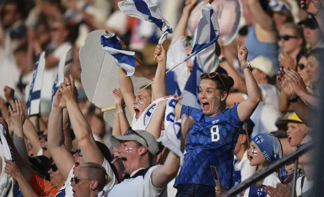 Finland fans celebrate at the end of the Euro 2025, group A, soccer match between Iceland and Finland at Arena Thun in Thun, Switzerland, Wednesday, July 2, 2025. (AP Photo/Alessandra Tarantino)