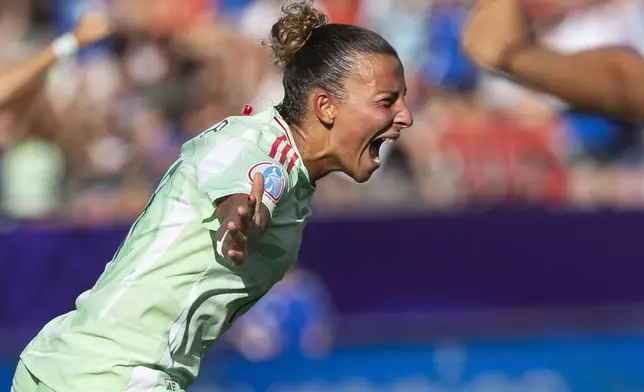 Italy's Arianna Caruso celebrates scoring during the Euro 2025, group B, soccer match between Belgium and Italy at Stade de Tourbillon in Sion, Switzerland, Thursday, July 3, 2025. (Cyril Zingaro/Keystone via AP)