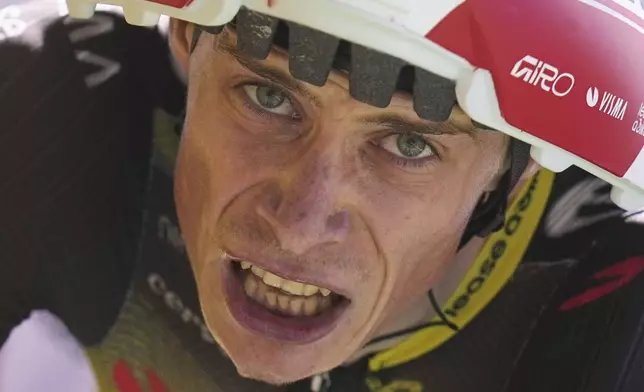 Denmark's Jonas Vingegaard crosses the finish line of the thirteenth stage of the Tour de France cycling race, an individual time-trial over 10.5 kilometers (6.5 miles) in the Pyrenees mountains with start in Loudenvielle and finish in Peyragudes, France, Friday, July 18, 2025. (AP Photo/Thibault Camus)