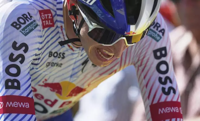 Germany's Florian Lipowitz strains during the thirteenth stage of the Tour de France cycling race, an individual time-trial over 10.5 kilometers (6.5 miles) in the Pyrenees mountains with start in Loudenvielle and finish in Peyragudes, France, Friday, July 18, 2025. (AP Photo/Thibault Camus)
