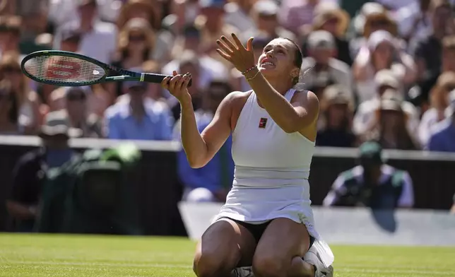 Aryana Sabalenka of Belarus reacts after losing a point against Laura Siegemund of Germany during a quarterfinal women's singles match at the Wimbledon Tennis Championships in London, Tuesday, July 8, 2025. (AP Photo/Kirsty Wigglesworth)