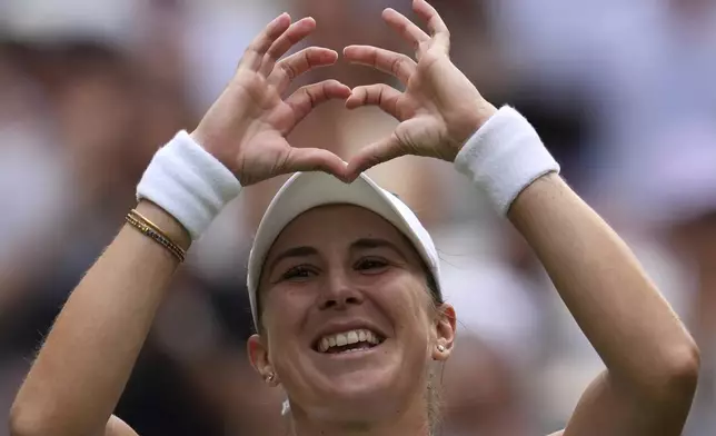 Switzerland's Belinda Bencic celebrates after beating Mirra Andreeva of Russia in a quarterfinal women's singles match between at the Wimbledon Tennis Championships in London, Wednesday, July 9, 2025. (AP Photo/Kin Cheung)