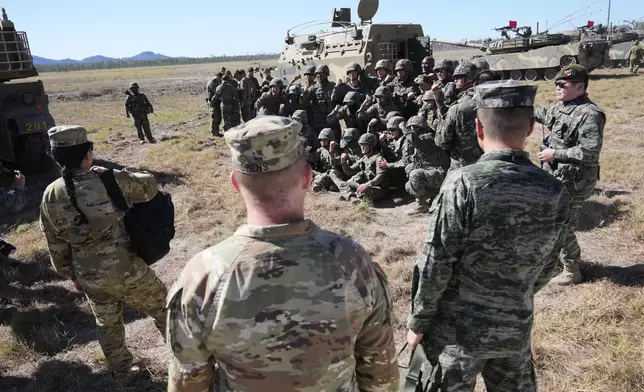 South Korean soldiers pose for a photo dduring Exercise Talisman Sabre 2025, Australia's largest-ever war fighting drills at Shoalwater Bay Training Area, near Rockhampton, Australia, Monday, July 14, 2025. (AP Photo/Rick Rycroft)