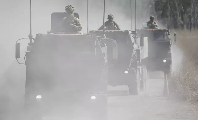 Australian defence force drive their High Mobility Artillery Rocket System for firing during Exercise Talisman Sabre 2025, Australia's largest-ever war fighting drills at Shoalwater Bay Training Area, near Rockhampton, Australia, Monday, July 14, 2025. (AP Photo/Rick Rycroft)