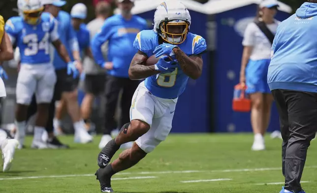 Los Angeles Chargers running back Omarion Hampton runs through a drill during an NFL football training camp Tuesday, July 22, 2025, in San Diego. (AP Photo/Gregory Bull)