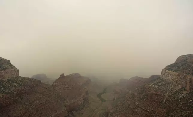 Smoke from the Dragon Bravo Fire moves over the Grand Canyon from the North Rim, Monday, July 14, 2025, in Grand Canyon National Park, Ariz. (AP Photo/Ross D. Franklin)