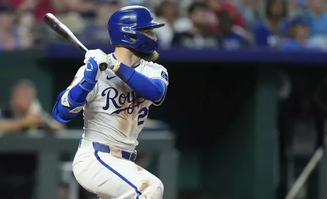 Kansas City Royals' Kyle Isbel watches his three-run double during the sixth inning of a baseball game against the Atlanta Braves, Tuesday, July 29, 2025, in Kansas City, Mo. (AP Photo/Charlie Riedel)