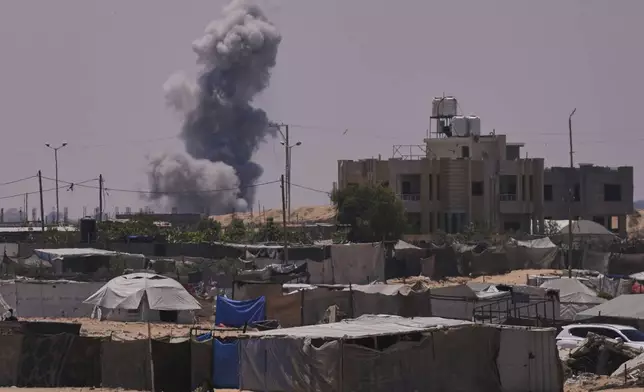 Smoke rises to the sky following an Israeli army airstrike in Khan Younis, southern Gaza Strip, Saturday, July 19, 2025. (AP Photo/Abdel Kareem Hana)