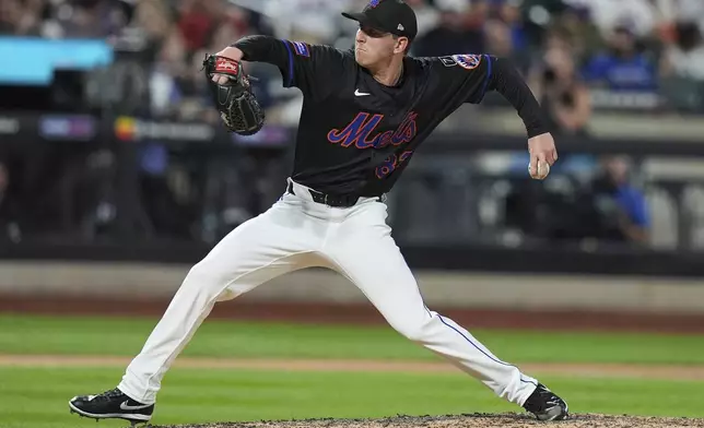 New York Mets' Brandon Waddell pitches during the eighth inning of a baseball game against the Cincinnati Reds Friday, July 18, 2025, in New York. (AP Photo/Frank Franklin II)