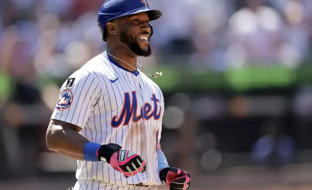 New York Mets' Starling Marte reacts after flying out to end the sixth inning of a baseball game against the New York Yankees, Sunday, July 6, 2025, in New York. (AP Photo/Adam Hunger)