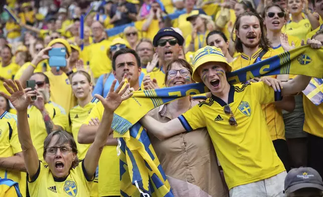 Swedish fans cheer ahead of the Euro 2025, group C, soccer match between Denmark and Sweden at Stade de Geneve in Geneva, Switzerland, Friday, July 4, 2025. (AP Photo/Alessandra Tarantino)