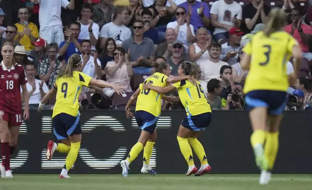 Sweden's Filippa Angeldahl celebrates after scoring her side's first goal during the Euro 2025, group C, soccer match between Denmark and Sweden at Stade de Geneve in Geneva, Switzerland, Friday, July 4, 2025. (AP Photo/Alessandra Tarantino)